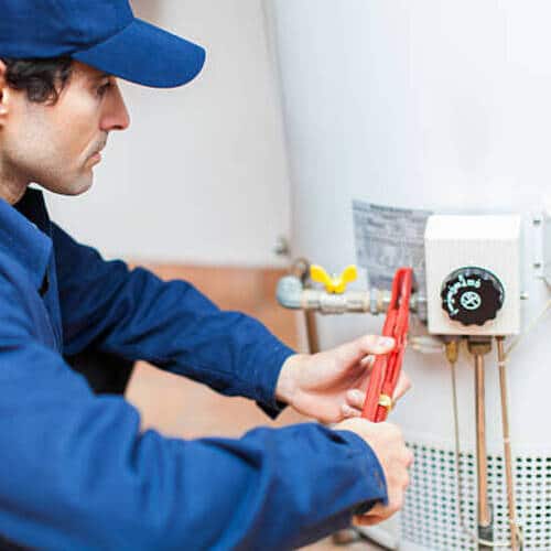 plumber installing a water heater